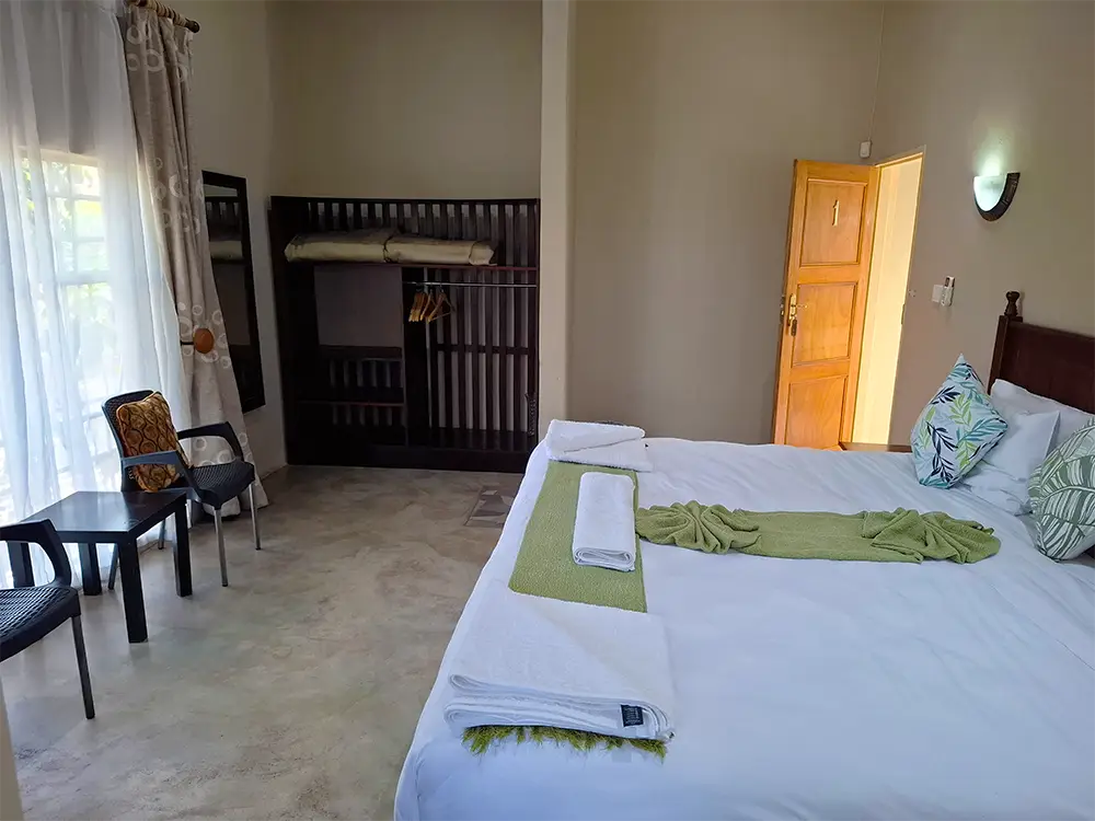 Guest room with a double bed and wardrobe